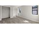 Bedroom with grey carpet, large closet and a window at 1807 Simonton Ave, Orlando, FL 32806