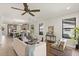 Bright and airy living room featuring an open layout, modern furniture, and stylish ceiling fan at 1807 Simonton Ave, Orlando, FL 32806