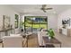 Bright living room featuring hardwood floors, contemporary furniture, backyard views, and neutral tones at 1807 Simonton Ave, Orlando, FL 32806