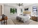 Serene main bedroom featuring large windows, neutral decor, and a comfortable king-sized bed at 1807 Simonton Ave, Orlando, FL 32806