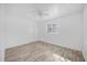 Bedroom with wood-look floors, ceiling fan, and window view at 1866 Matterhorn Dr, Orlando, FL 32818