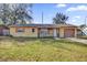 Charming single-story home featuring a front lawn and an attached one car garage at 1866 Matterhorn Dr, Orlando, FL 32818