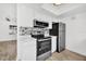 Modern kitchen with white cabinets, stainless steel appliances, and stylish backsplash for cooking convenience at 1866 Matterhorn Dr, Orlando, FL 32818