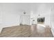 Bright living room boasts new wood-look flooring and a seamless flow into other living spaces at 1866 Matterhorn Dr, Orlando, FL 32818