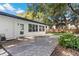 Private backyard features a spacious stone patio perfect for outdoor entertaining with lush greenery enhancing the serene setting at 2913 Carmia Dr, Orlando, FL 32806