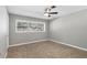 Inviting bedroom with a ceiling fan and natural light. A calm and neutral color palette enhances the relaxing atmosphere at 2913 Carmia Dr, Orlando, FL 32806