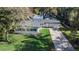 Aerial view of a charming home featuring a well-maintained lawn and inviting curb appeal at 2913 Carmia Dr, Orlando, FL 32806