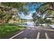 Lake view from the wood deck surrounded by mature trees at 2913 Carmia Dr, Orlando, FL 32806