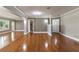 Spacious living room featuring hardwood floors, neutral walls, and abundant natural light streaming through ample windows at 2913 Carmia Dr, Orlando, FL 32806