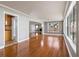 Open-concept living space showcases gleaming hardwood floors, abundant natural light, and a seamless flow into the kitchen at 2913 Carmia Dr, Orlando, FL 32806