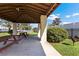 Community picnic area with tables, grill, and a covered shelter near the lake at 2913 Carmia Dr, Orlando, FL 32806