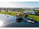 Aerial view of community lake, dock with gazebo, and boat rentals at 2945 Simile St, Kissimmee, FL 34746