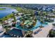 Aerial view of a resort-style community lazy river, mini golf and surrounding homes at 2945 Simile St, Kissimmee, FL 34746