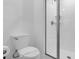 Modern bathroom featuring a glass-enclosed shower and a toilet at 2945 Simile St, Kissimmee, FL 34746