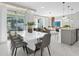 Inviting dining area connects the kitchen and living spaces with a stylish table and ample seating at 2945 Simile St, Kissimmee, FL 34746