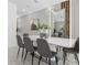 Elegant dining area features a modern table, stylish chairs, and sophisticated lighting at 2945 Simile St, Kissimmee, FL 34746