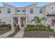 Inviting townhome showcases a contemporary architectural style with well-maintained landscaping at 2945 Simile St, Kissimmee, FL 34746