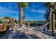 Sandy community beach with a hammock and lakeside views at 2945 Simile St, Kissimmee, FL 34746