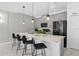 Modern kitchen features sleek cabinetry, stainless steel appliances, and a spacious center island at 2945 Simile St, Kissimmee, FL 34746