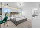 Bright main bedroom features a plush bed, contemporary decor, and a serene ambiance at 2945 Simile St, Kissimmee, FL 34746