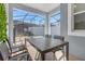 Screened in patio with a dining table and chairs overlooking the swimming pool at 2945 Simile St, Kissimmee, FL 34746