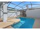 Inviting swimming pool with lounge chairs and a screened-in enclosure at 2945 Simile St, Kissimmee, FL 34746