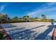 Community sand volleyball court with playground visible in the background on a sunny day at 2945 Simile St, Kissimmee, FL 34746