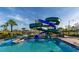 Community pool with water slide and palm trees for Gathering fun in the sun at 2945 Simile St, Kissimmee, FL 34746