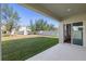 Covered patio view of the expansive fenced-in backyard with lush lawn at 3270 Mt Vernon Way, Kissimmee, FL 34741