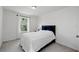 Well-lit bedroom with a large window offering a view of lush greenery at 3270 Mt Vernon Way, Kissimmee, FL 34741