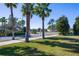 A beautiful entrance to the community with palm trees and lush landscaping at 3270 Mt Vernon Way, Kissimmee, FL 34741