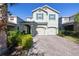 Charming two-story home featuring a two-car garage and a well-manicured front yard at 3270 Mt Vernon Way, Kissimmee, FL 34741