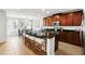 Modern kitchen island with stool seating, dark cabinetry, and stainless steel appliances at 3270 Mt Vernon Way, Kissimmee, FL 34741