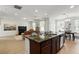 Open-concept kitchen flows into the living room and features granite countertops at 3270 Mt Vernon Way, Kissimmee, FL 34741
