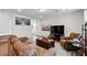 Comfortable living room featuring a leather sofa and recliner with an open concept at 3270 Mt Vernon Way, Kissimmee, FL 34741