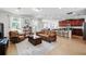 Open concept living room showcasing leather furniture and seamless flow to the kitchen at 3270 Mt Vernon Way, Kissimmee, FL 34741