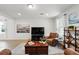 Comfortable living room featuring a leather recliner, stylish decor, and a neutral color palette at 3270 Mt Vernon Way, Kissimmee, FL 34741