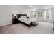 Bright main bedroom with a king-size bed, neutral colors, and plenty of natural light at 3270 Mt Vernon Way, Kissimmee, FL 34741