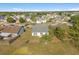Aerial view of a home situated on a lush landscape with scattered trees at 3304 Kelsey Ln, St Cloud, FL 34772