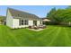 Spacious backyard with outdoor furniture and umbrella, perfect for entertaining at 3304 Kelsey Ln, St Cloud, FL 34772