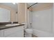 This is a bathroom with a single sink vanity and a shower/tub combo at 3304 Kelsey Ln, St Cloud, FL 34772