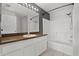 Bathroom featuring a vanity with a dark countertop and a shower-tub combination at 3304 Kelsey Ln, St Cloud, FL 34772