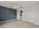 Minimalist bedroom with an ensuite bathroom, closet, and neutral paint at 3304 Kelsey Ln, St Cloud, FL 34772