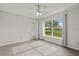 Serene bedroom with natural light, tile floors, and a view of the outdoors at 3304 Kelsey Ln, St Cloud, FL 34772