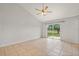Bright bedroom with tile flooring and sliding glass door access to the backyard at 3304 Kelsey Ln, St Cloud, FL 34772