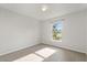 Bedroom with light colored walls and a window with a backyard view at 3304 Kelsey Ln, St Cloud, FL 34772