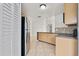 Functional kitchen with stainless steel appliances, tile flooring, and ample storage space at 3304 Kelsey Ln, St Cloud, FL 34772