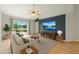Cozy living room with tile flooring, modern furnishings, and a view of the lake at 3304 Kelsey Ln, St Cloud, FL 34772