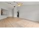 Spacious living area with tile floors, high ceilings, and ample natural light at 3304 Kelsey Ln, St Cloud, FL 34772