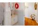 Stylish bathroom with a single sink vanity and decorative wall art, well-lit space at 3520 Arch St, Orlando, FL 32808